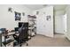 Comfortable bedroom featuring a desk, shelving, and standard closet doors at 16126 Sunday Stroll Way, Odessa, FL 33556