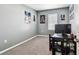 Cozy bedroom with carpet, window, and themed posters, ideal for personalization at 16126 Sunday Stroll Way, Odessa, FL 33556