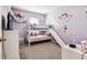 Purple bedroom with a bunk bed and a slide, offering a fun and playful space at 16126 Sunday Stroll Way, Odessa, FL 33556