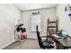 Bright bedroom with window, desk, and shelving, ideal for a home office or study space at 16126 Sunday Stroll Way, Odessa, FL 33556