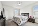 Bedroom with carpet, two windows with blinds, and a ceiling fan at 16126 Sunday Stroll Way, Odessa, FL 33556