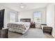 Bedroom with carpet, two windows with blinds, and a ceiling fan at 16126 Sunday Stroll Way, Odessa, FL 33556