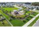 Overhead shot of community park with playground, green space, sidewalks, and neighborhood homes beyond at 16126 Sunday Stroll Way, Odessa, FL 33556
