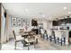 Dining area with a wood table and chairs next to the kitchen at 16126 Sunday Stroll Way, Odessa, FL 33556