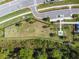Aerial view of community dog park with agility equipment and fenced area at 16126 Sunday Stroll Way, Odessa, FL 33556