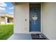 Charming front door with a welcome sign and a cute doormat, setting a warm tone at 16126 Sunday Stroll Way, Odessa, FL 33556