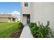 Inviting front entrance with manicured shrubs and a walkway to the charming front door at 16126 Sunday Stroll Way, Odessa, FL 33556