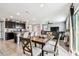 Open floor plan shows the kitchen, dining area, and living room at 16126 Sunday Stroll Way, Odessa, FL 33556