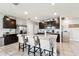 Open kitchen featuring a center island, stainless steel appliances, and granite countertops at 16126 Sunday Stroll Way, Odessa, FL 33556