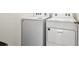 Well maintained laundry room features side by side washing machine and dryer at 16126 Sunday Stroll Way, Odessa, FL 33556