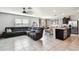 Open-concept living area seamlessly blends the living room, dining area, and kitchen, perfect for entertaining at 16126 Sunday Stroll Way, Odessa, FL 33556