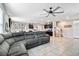 Open-concept living area seamlessly connects the living room, dining space, and kitchen, ideal for entertaining at 16126 Sunday Stroll Way, Odessa, FL 33556