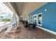 Inviting outdoor lounge area with comfortable seating and brick-paved floor, perfect for relaxation and socializing at 16126 Sunday Stroll Way, Odessa, FL 33556