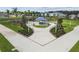 Landscaped walking path leading to a picnic shelter surrounded by trees and benches at 16126 Sunday Stroll Way, Odessa, FL 33556