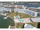 A stunning aerial view of the property, featuring a swimming pool, beautiful landscaping, and waterfront access at 1868 Shore S Dr # 602, South Pasadena, FL 33707