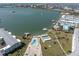Aerial shot of a pool near the ocean with a view of buildings and boats at 1868 Shore S Dr # 602, South Pasadena, FL 33707