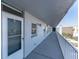Exterior hallway featuring unit door with view of the adjacent building at 1868 Shore S Dr # 602, South Pasadena, FL 33707