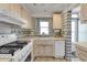 Charming kitchen with white appliances, wood cabinets, and ample counter space at 1868 Shore S Dr # 602, South Pasadena, FL 33707