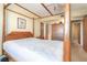 Main bedroom with a four-poster bed, ceiling fan, and closet at 1868 Shore S Dr # 602, South Pasadena, FL 33707