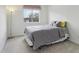 Bedroom features a bed, neutral walls, and natural light at 20115 Nob Oak Ave, Tampa, FL 33647