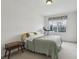 Cozy bedroom with a large window and a comfortable bed and carpets at 20115 Nob Oak Ave, Tampa, FL 33647