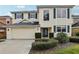 Two-story home with manicured landscaping, green shutters, and a two-car garage at 20115 Nob Oak Ave, Tampa, FL 33647