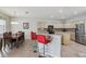 Eat-in kitchen featuring stainless steel appliances, tiled backsplash, and adjacent dining area at 20115 Nob Oak Ave, Tampa, FL 33647
