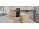 Well-equipped kitchen with stainless steel appliances and a center island at 20115 Nob Oak Ave, Tampa, FL 33647