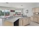 Kitchen sink and bar overlooking the sliding glass door to the pool at 20115 Nob Oak Ave, Tampa, FL 33647