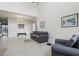 Spacious living room with tall ceilings, tile floors, and comfortable seating arrangement at 20115 Nob Oak Ave, Tampa, FL 33647