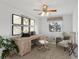Staged office with a desk, chair, and decorative maps at 20115 Nob Oak Ave, Tampa, FL 33647
