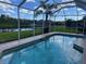 Relaxing screened-in pool with beautiful views of the lake and the neighborhood at 20115 Nob Oak Ave, Tampa, FL 33647