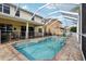 Backyard pool features a brick deck and fenced-in area at 20115 Nob Oak Ave, Tampa, FL 33647