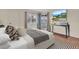 Relaxing bedroom with large window, access to porch and flat screen TV at 204 Mary Dr, Oldsmar, FL 34677