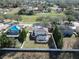 Aerial view of the property highlights the screened pool, manicured lawn, and fenced backyard oasis at 2108 Valrico Heights Blvd, Valrico, FL 33594