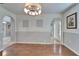 Open-concept dining room with wood floors and arched doorways to other rooms at 2108 Valrico Heights Blvd, Valrico, FL 33594