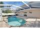 Backyard pool with screened enclosure and brick paver surround at 2108 Valrico Heights Blvd, Valrico, FL 33594