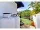 Backyard view showcasing the lawn and various features, enclosed by a white privacy fence at 2113 S West Shore Blvd, Tampa, FL 33629