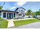 Beautiful backyard featuring a sparkling pool, lush landscaping, and a stylish patio area at 2113 S West Shore Blvd, Tampa, FL 33629