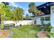 Secluded backyard showcasing a well-manicured lawn and vibrant greenery, perfect for relaxation at 2113 S West Shore Blvd, Tampa, FL 33629