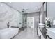 A modern bathroom with a beautiful freestanding tub and sleek glass shower at 2113 S West Shore Blvd, Tampa, FL 33629