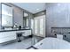 A stylish bathroom with a soaking tub, a glass shower, and a double vanity at 2113 S West Shore Blvd, Tampa, FL 33629