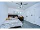 This bedroom has a cozy bed with plush bedding and features neutral walls and floors at 2113 S West Shore Blvd, Tampa, FL 33629