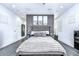 The main bedroom has a king bed, hardwood floors, and modern decor at 2113 S West Shore Blvd, Tampa, FL 33629