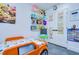 Well-lit bedroom featuring educational decorations, toy shelves, and a unique car bed at 2113 S West Shore Blvd, Tampa, FL 33629