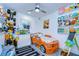 Bright ' bedroom with custom car bed, fun decor, and ample toy storage at 2113 S West Shore Blvd, Tampa, FL 33629