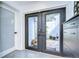 An entryway features a double door with glass panels allowing natural light into the space at 2113 S West Shore Blvd, Tampa, FL 33629