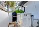 Exterior shot of the house showing a generator and a gate at 2113 S West Shore Blvd, Tampa, FL 33629