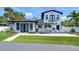 Backyard view showcasing pool, spa, outdoor kitchen and outdoor entertaining area at 2113 S West Shore Blvd, Tampa, FL 33629