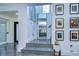 The foyer features high ceilings, a modern mirror, and an art gallery at 2113 S West Shore Blvd, Tampa, FL 33629